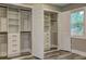 Walk-in closet with built-in shelves, drawers and herringbone wallpaper at 1675 Bouldercliff Se Ct, Atlanta, GA 30316