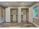 Walk-in closet with built-in shelves, drawers and herringbone wallpaper at 1675 Bouldercliff Se Ct, Atlanta, GA 30316