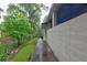 A long block wall along the side of a one-story home with a green lawn at 1675 Bouldercliff Se Ct, Atlanta, GA 30316