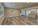 Spacious living room featuring stylish wood flooring and recessed lighting at 1675 Bouldercliff Se Ct, Atlanta, GA 30316