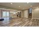 Open floor plan connecting the living room and kitchen with stainless steel appliances at 1675 Bouldercliff Se Ct, Atlanta, GA 30316