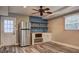 A wet bar in the living room with stainless steel appliances and stylish shelving at 1675 Bouldercliff Se Ct, Atlanta, GA 30316