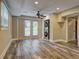 Bright room with hardwood floors, ceiling fan, and glass doors to the backyard at 1675 Bouldercliff Se Ct, Atlanta, GA 30316