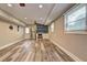 Spacious living room area with hardwood floors and a custom beverage center at 1675 Bouldercliff Se Ct, Atlanta, GA 30316