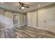 Main bedroom with ensuite, ceiling fan and three white closets at 1675 Bouldercliff Se Ct, Atlanta, GA 30316