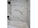 Shower features white marble-look tile and matte black fixtures at 1675 Bouldercliff Se Ct, Atlanta, GA 30316