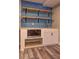 Close up of custom blue-tiled wet bar with modern fixtures and shelving at 1675 Bouldercliff Se Ct, Atlanta, GA 30316