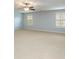 Bright, carpeted bedroom with two windows offering plenty of natural light at 308 Shade Tree Cir, Woodstock, GA 30188