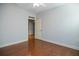 Inviting bedroom with hardwood floors, neutral walls, and multiple doorways at 308 Shade Tree Cir, Woodstock, GA 30188