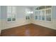 Refined dining room featuring hardwood floors, plantation shutters, and elegant wainscoting detail at 308 Shade Tree Cir, Woodstock, GA 30188