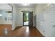 Elegant foyer featuring hardwood floors, wainscoting, and ample natural light, offering a warm welcome at 308 Shade Tree Cir, Woodstock, GA 30188