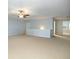 Spacious living room featuring neutral walls and carpet, complemented by a modern ceiling fan and ample natural light at 308 Shade Tree Cir, Woodstock, GA 30188