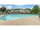 Large swimming pool surrounded by comfortable lounge chairs, lush greenery, and access to nearby amenities at 308 Shade Tree Cir, Woodstock, GA 30188