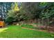 Backyard features a small vegetable garden with a retaining wall at 5410 Cottage Farm Rd, Alpharetta, GA 30022