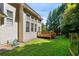 Backyard view of the home, with a wood deck and lush green grass at 5410 Cottage Farm Rd, Alpharetta, GA 30022