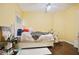 Bright bedroom with hardwood floors and a large bed at 5410 Cottage Farm Rd, Alpharetta, GA 30022
