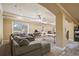 Finished basement living room area featuring a sofa and a work area at 5410 Cottage Farm Rd, Alpharetta, GA 30022