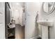 Welcoming entryway with hardwood floors and a charming powder room at 7086 Gladstone Cir, Lithonia, GA 30038