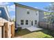 View of the exterior of the home with a small patio and fenced yard at 7086 Gladstone Cir, Lithonia, GA 30038