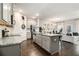 Bright kitchen features a large island, granite countertops, and stainless steel appliances at 7086 Gladstone Cir, Lithonia, GA 30038