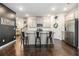 Stylish kitchen with a central island, stainless steel appliances, and modern finishes at 7086 Gladstone Cir, Lithonia, GA 30038