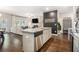 Open concept kitchen that flows into the living and dining areas with modern stainless appliances at 7086 Gladstone Cir, Lithonia, GA 30038