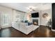 Cozy living room featuring a fireplace, ceiling fan, and comfortable seating area at 7086 Gladstone Cir, Lithonia, GA 30038