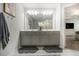Main bath with double vanity, a large mirror, and modern lighting at 7086 Gladstone Cir, Lithonia, GA 30038