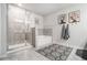 Luxurious main bathroom featuring a glass enclosed shower and separate soaking tub at 7086 Gladstone Cir, Lithonia, GA 30038