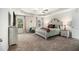 Spacious main bedroom with trey ceiling, plush carpet and natural light at 7086 Gladstone Cir, Lithonia, GA 30038