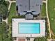 Aerial view of a sparkling community pool, lounge chairs, and lush landscaping at 1150 Collier Nw Rd # B5, Atlanta, GA 30318