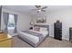 A comfortably decorated bedroom with a gray color scheme, ceiling fan, and good natural light at 1150 Collier Nw Rd # B5, Atlanta, GA 30318