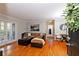 Hardwood floors, lots of light, and a cozy sectional make this living room very inviting at 1150 Collier Nw Rd # B5, Atlanta, GA 30318