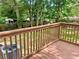 View from stained back deck overlooking a leafy yard with mature trees and new HVAC at 256 New Hope Rd, Lawrenceville, GA 30046