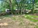 Fenced backyard with mature trees offers privacy and plenty of green space at 256 New Hope Rd, Lawrenceville, GA 30046