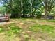 Large backyard with mature trees, a deck, and plenty of room for recreation at 256 New Hope Rd, Lawrenceville, GA 30046