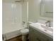 This bathroom features a shower and tub combination with a modern vanity at 256 New Hope Rd, Lawrenceville, GA 30046