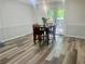 Cozy dining area features a table for four and access to a deck through glass doors at 256 New Hope Rd, Lawrenceville, GA 30046