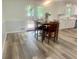 A dining area is conveniently located next to the kitchen, featuring a wooden table and access to the outdoors at 256 New Hope Rd, Lawrenceville, GA 30046