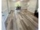 Open dining area with new floors, table, and natural light streaming through the sliding glass doors at 256 New Hope Rd, Lawrenceville, GA 30046