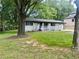 Picturesque home with mature trees, offering shade and curb appeal at 256 New Hope Rd, Lawrenceville, GA 30046