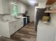 Bright kitchen featuring stainless steel appliances, ample cabinet space, and counter seating at 256 New Hope Rd, Lawrenceville, GA 30046