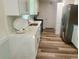 Modern kitchen with bright white countertops, stainless steel appliances, and a sleek faucet at 256 New Hope Rd, Lawrenceville, GA 30046