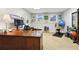 Finished basement featuring a home office area with a large wooden desk and workout area with weights at 2845 Burgundy Dr, Cumming, GA 30041