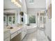 Bright bathroom featuring a spa tub, large vanity, and walk-in shower at 2845 Burgundy Dr, Cumming, GA 30041