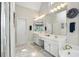 Bright bathroom featuring dual sinks, white cabinets, soaking tub, and stylish fixtures at 2845 Burgundy Dr, Cumming, GA 30041