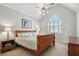 Spacious bedroom with ceiling fan and arched window, creating a serene and airy atmosphere at 2845 Burgundy Dr, Cumming, GA 30041