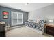 Cozy bedroom with a daybed near the window, providing ample natural light for a comfortable space at 2845 Burgundy Dr, Cumming, GA 30041