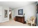Bedroom with a wooden dresser and classic chair, offers ample storage and a comfortable seating arrangement at 2845 Burgundy Dr, Cumming, GA 30041