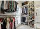 Walk-in closet with custom shelving, shoe storage, and natural light at 2845 Burgundy Dr, Cumming, GA 30041